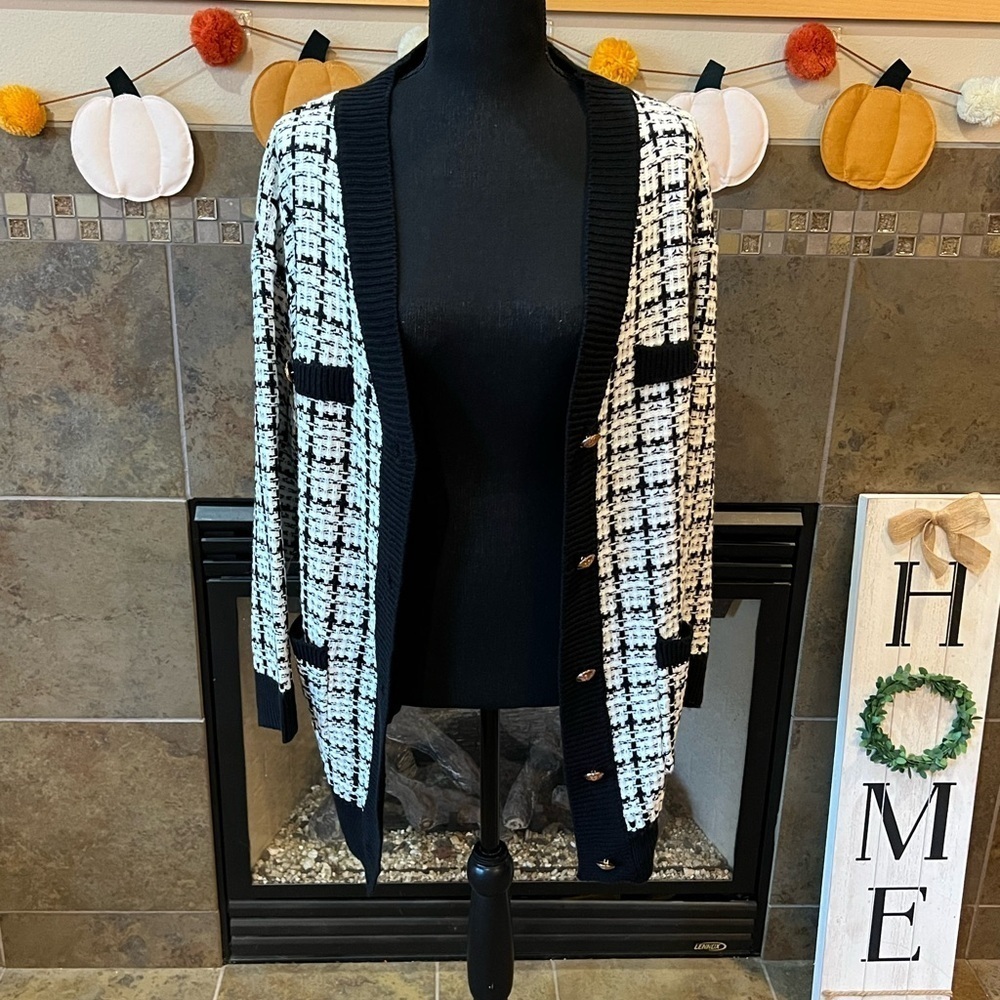 Black and white knit cardigan from First Love, size medium